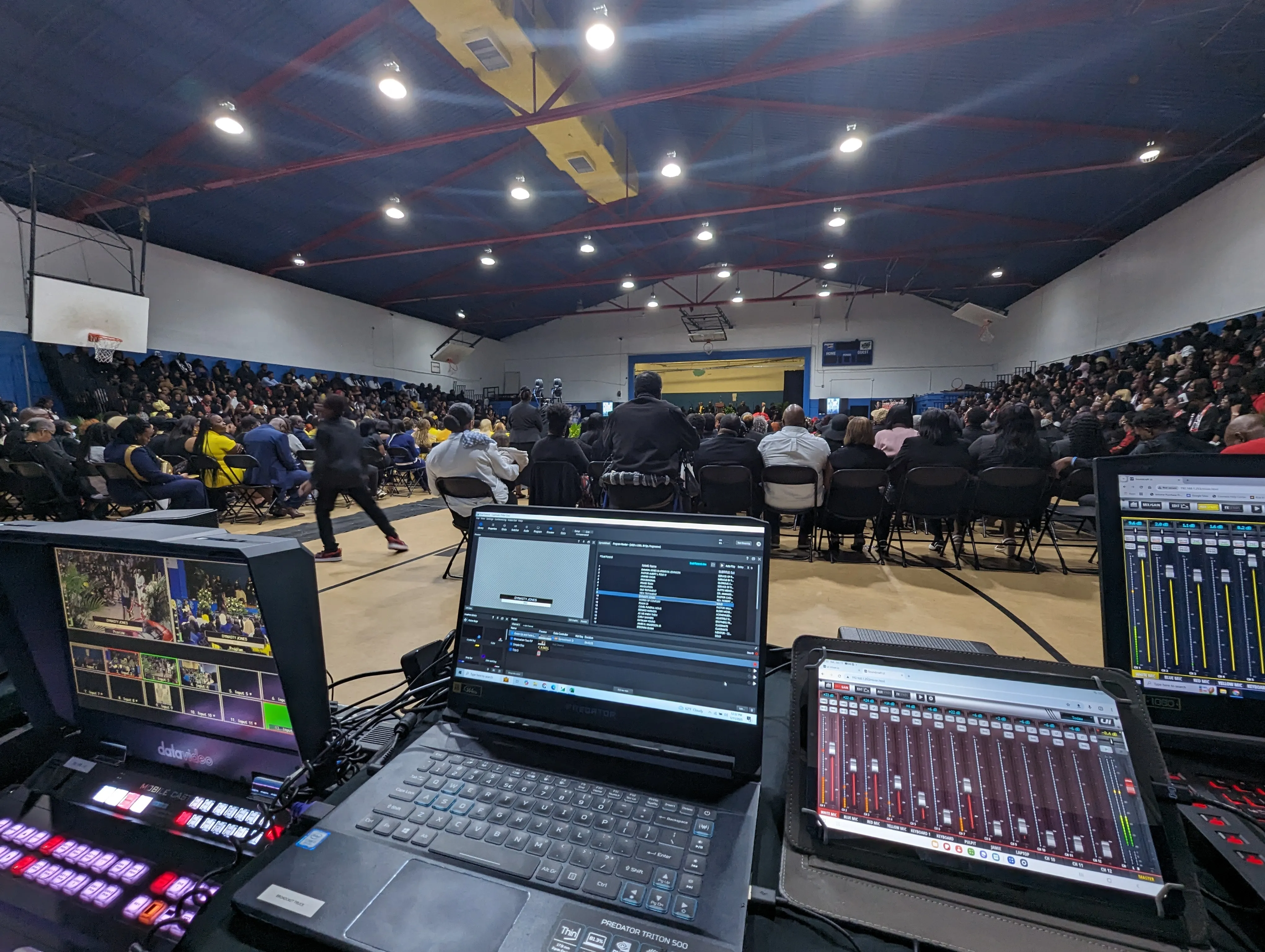 Wide view of more than 800 mourners at the Boys and Girls Club of Belle Glade, FL during the joint memorial service