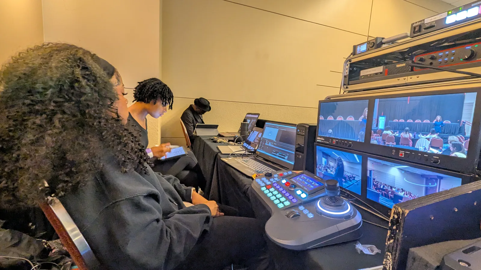 Conference production control position with Datavideo multiview monitors and PTZ controller