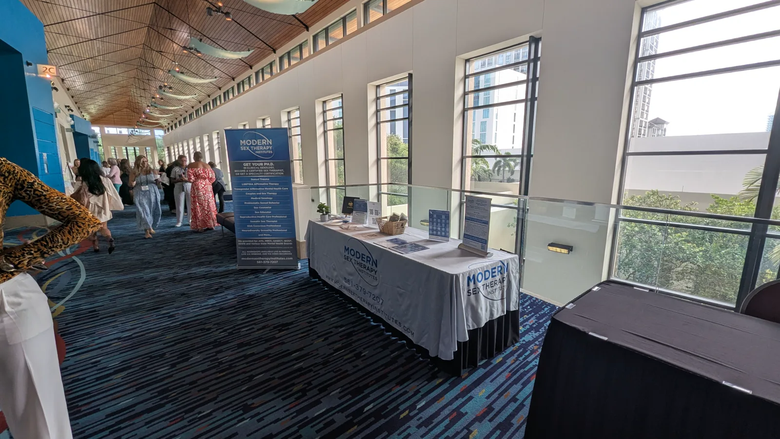 Modern Sex Therapy Institutes exhibitor table and registration area in the convention center