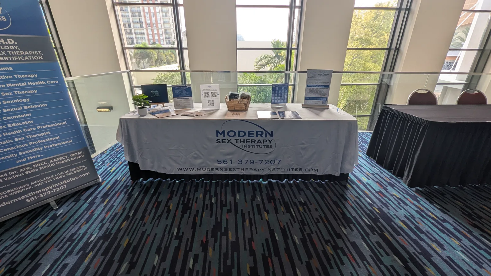 Modern Sex Therapy Institutes branded conference table with printed materials