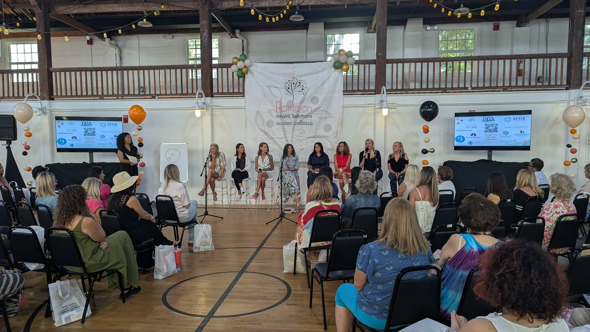 Audience listening to the women’s wellness panel at Old School Square