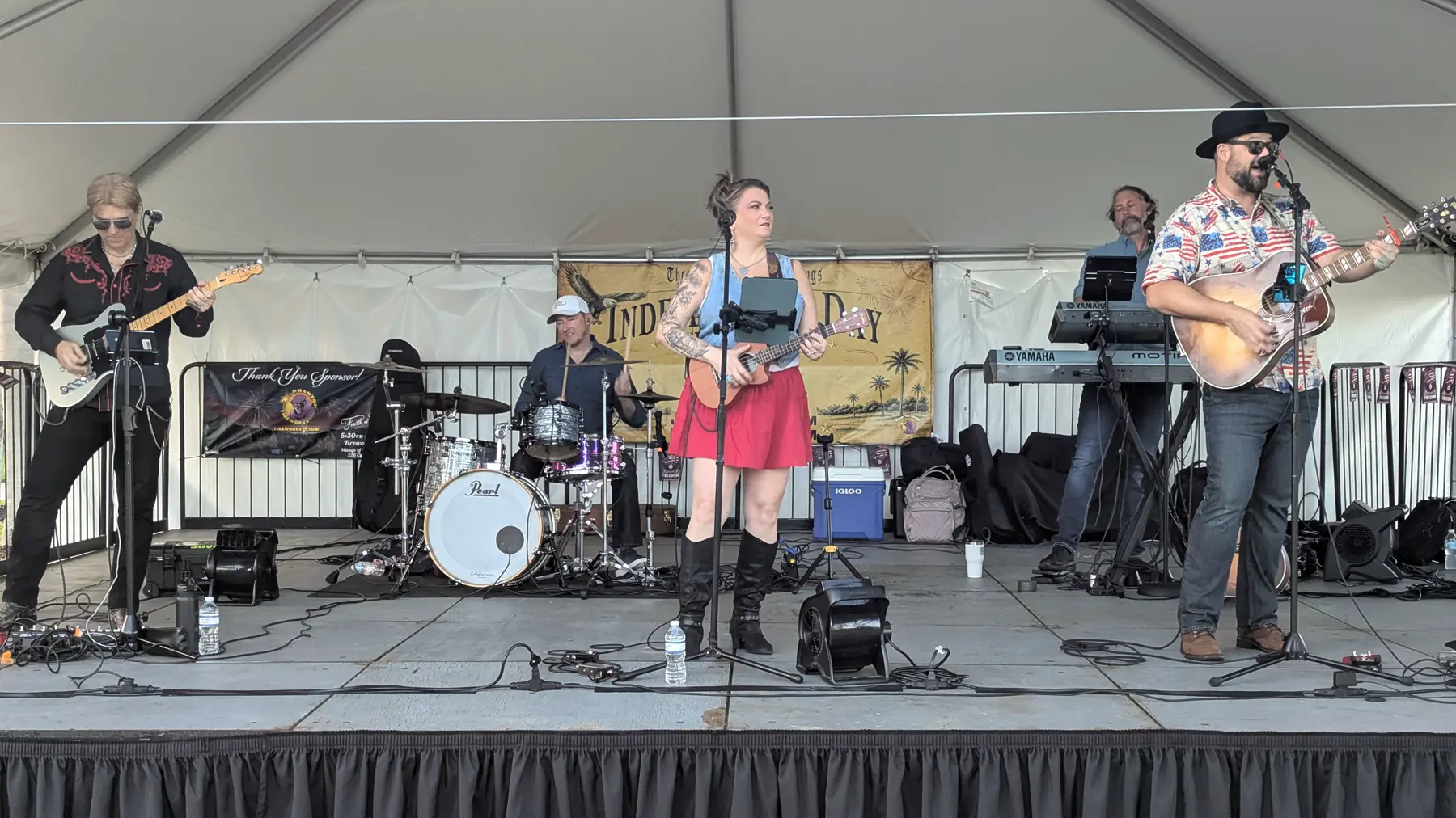 The Experience band performing on stage during the Village of Palm Springs 4th of July