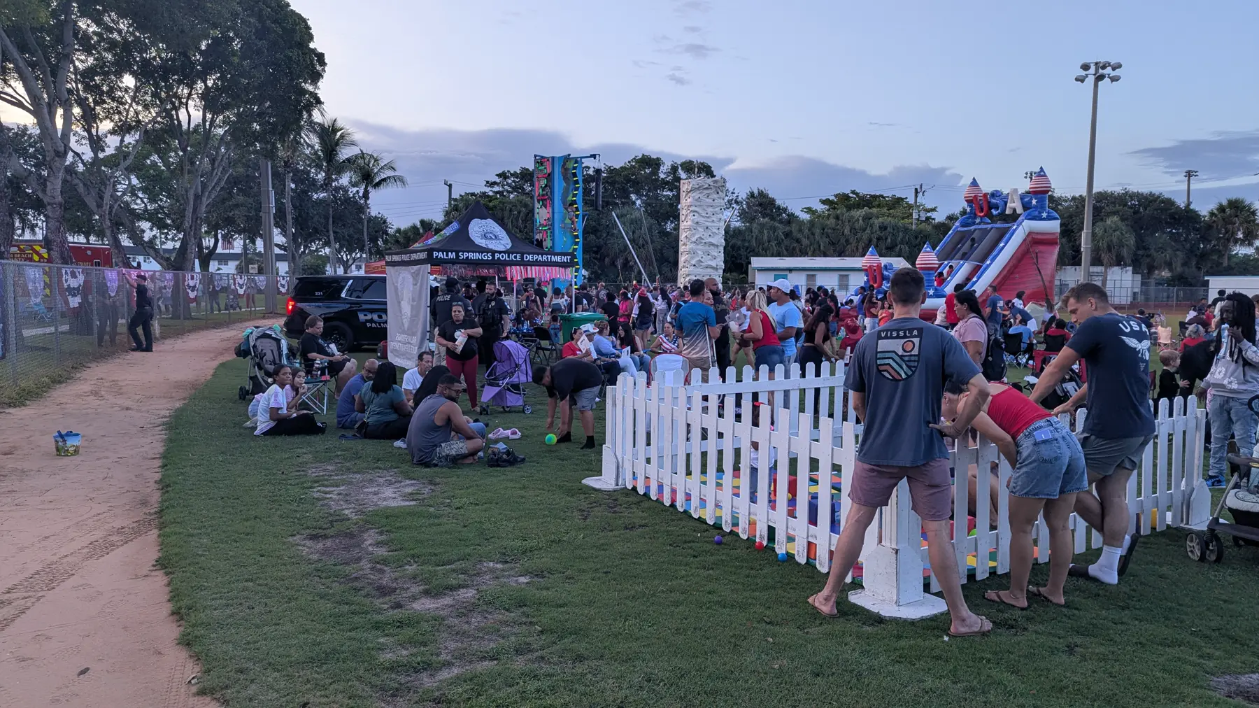 Vendor corridor in front of Palm Springs Police Department banner on 4th of July