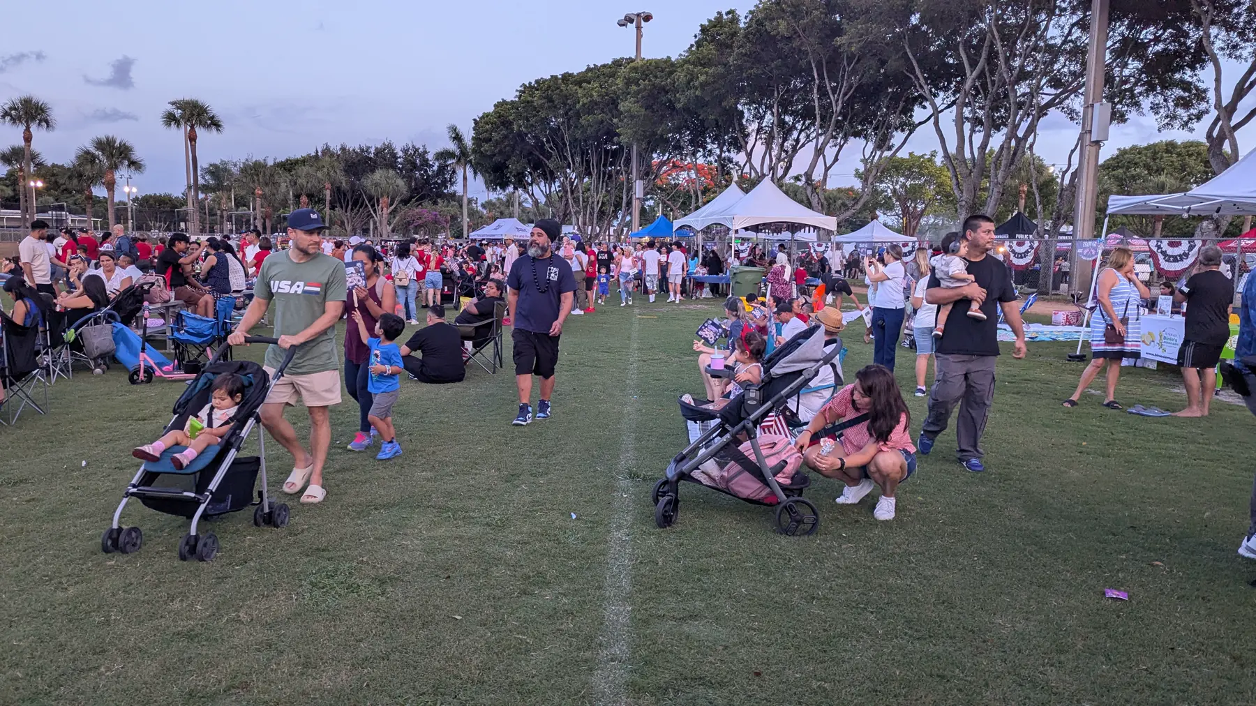 Panoramic view of the vendor walkway at the Village of Palm Springs Independence Day event