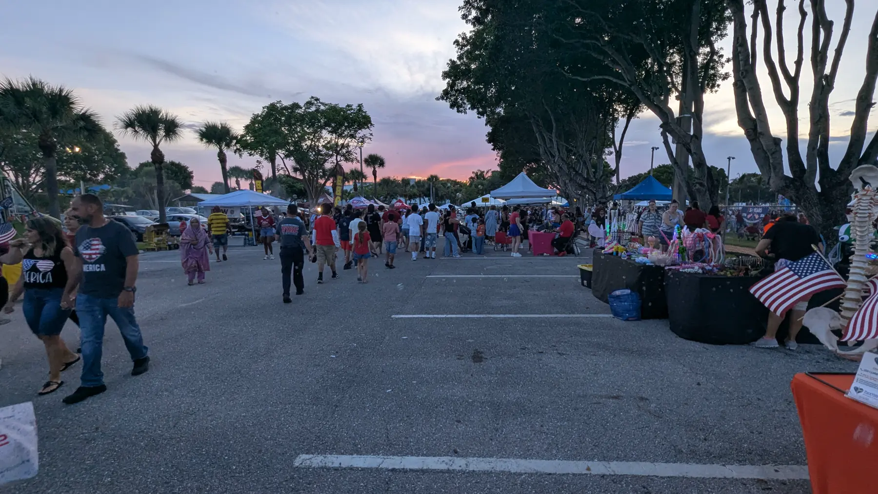 Vendor flag boulevard at twilight during the Village of Palm Springs Independence Day event