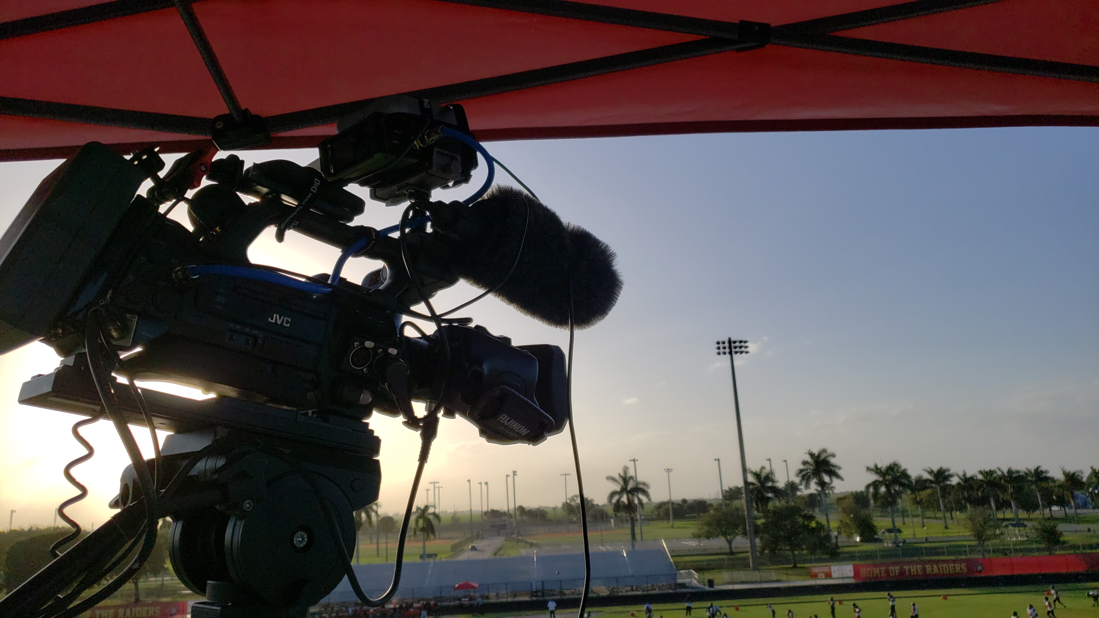 Professional broadcast camera positioned at a stadium for live sports coverage