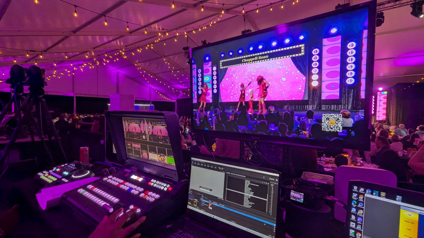 Live broadcast monitor showing the multi-camera program feed of a Kids Lip Sync performance