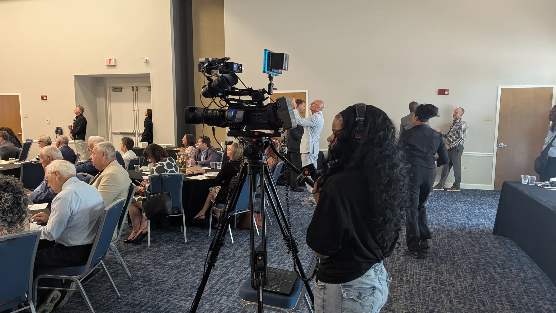 Camera operator streaming a conference session