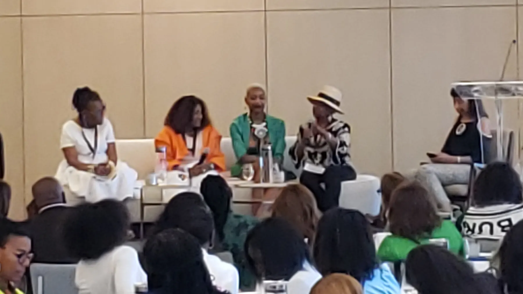 Panel discussion on stage at the Women of Color Empowerment Conference in Fort Lauderdale