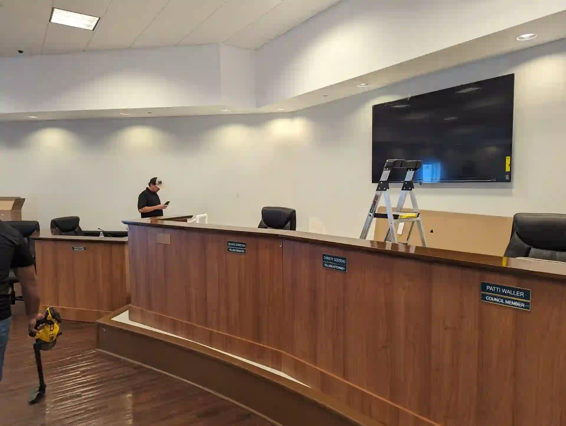 Village of Palm Springs Commission Chambers dais with wall-mounted Sony display and Datavideo PTZ camera