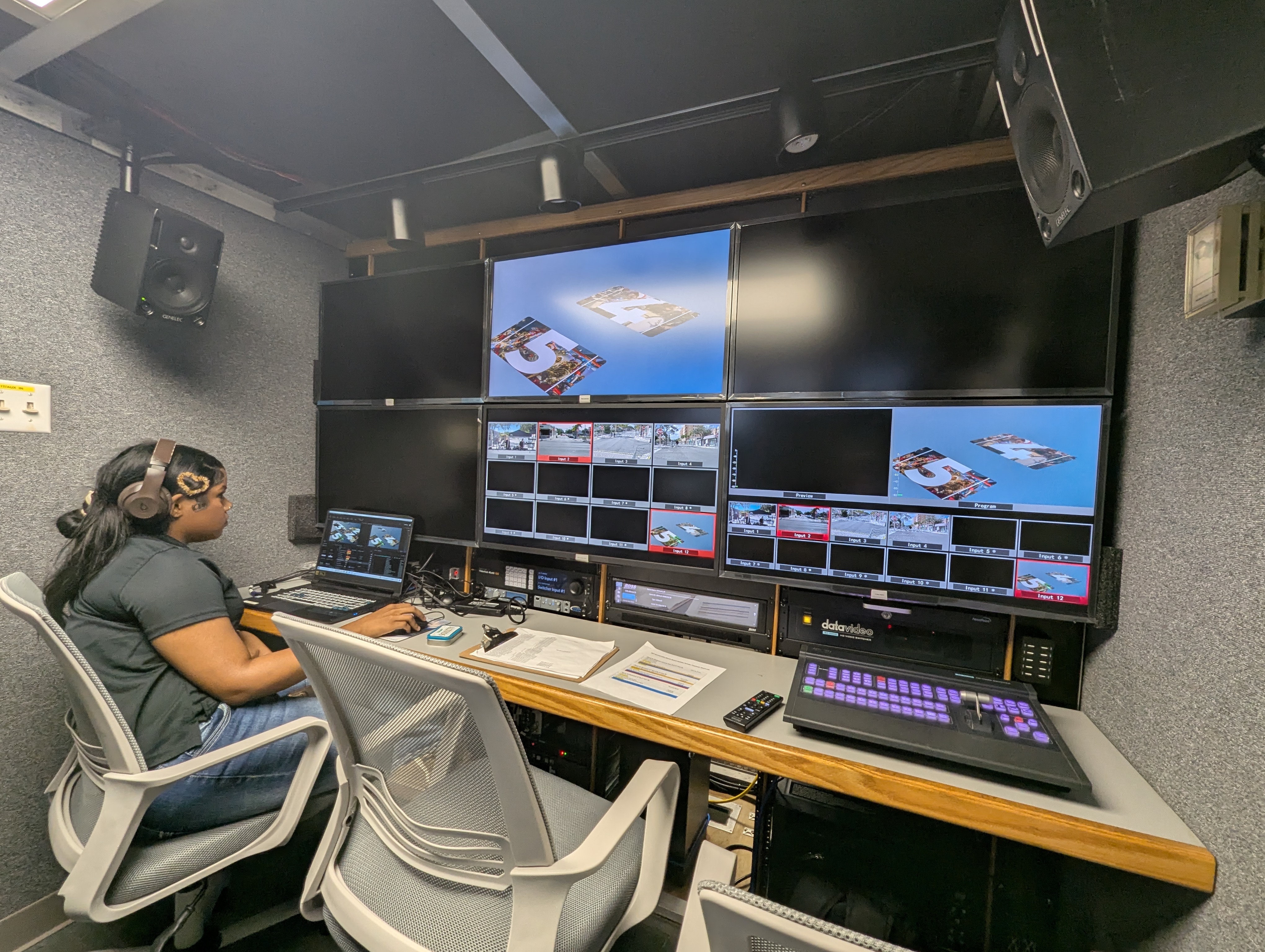 Graphics operator designing live on-air graphics inside the Primestar OB Truck control room before the Lake Worth Beach Holiday Parade broadcast
